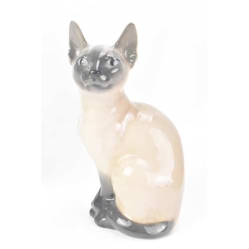 506 - Three Royal Copenhagen porcelain ornaments and a vase to include a Siamese cat model no. 2851/3281, ... 