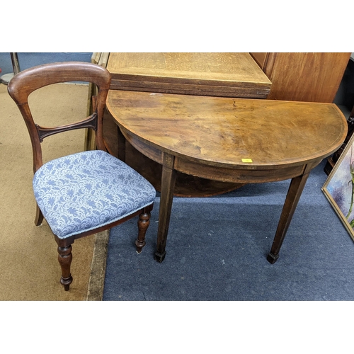 12 - A George III inlaid mahogany fold over dining table on square legs, and three Victorian mahogany fra... 