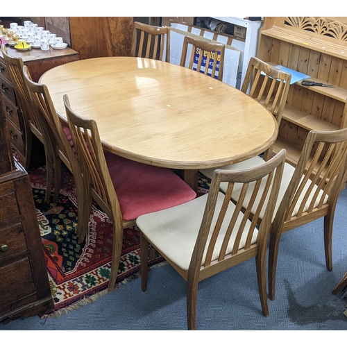 15 - A mid 20th century G-Plan Fresco range extending dining table 72cm h x 163cm w, together with a set ... 