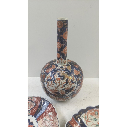 462 - A 19th century Japanese Imari bottle vase, 40cm h together with a 19th century Japanese charger and ... 