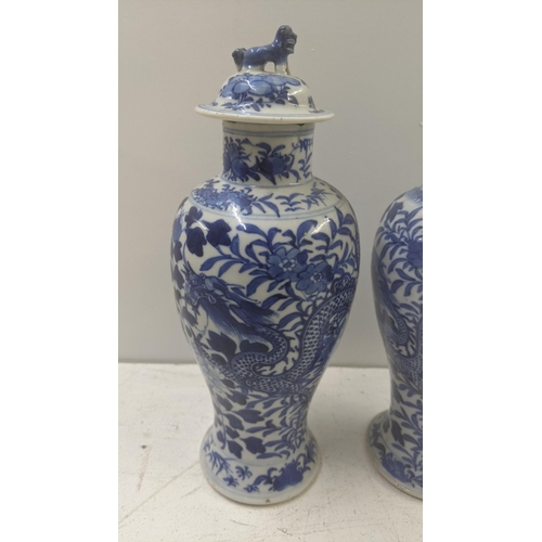 463 - A pair of late 19th century Chinese Kangxi style blue and white vases A/F
Location: R1.1/LWM
If ther... 