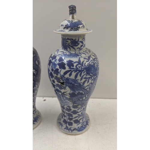 463 - A pair of late 19th century Chinese Kangxi style blue and white vases A/F
Location: R1.1/LWM
If ther... 