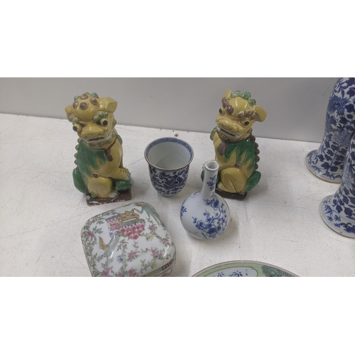 468 - A mixed oriental lot to include an early 20th century famille rose dish, two Foo dogs, a 19th centur... 