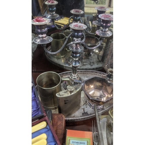 473 - A mixed lot of metalware to include Mappin & Webb tea pot and others, a silver plated hip flask with... 