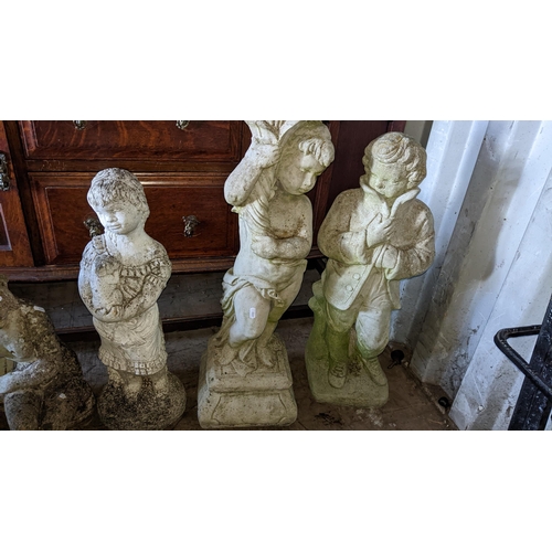 500 - Five garden stoneware statues to include one of a boy holding a cornucopia, 82cm high 
Location: RCo... 