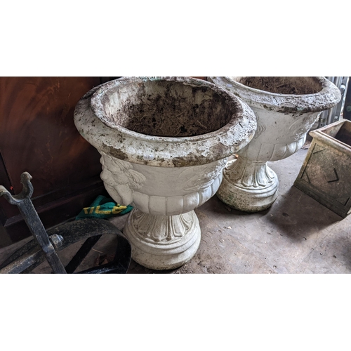 502 - A pair of cast stoneware garden planters in the form of Grecian urns, 66h x 56w
Location: RCon 
If t... 