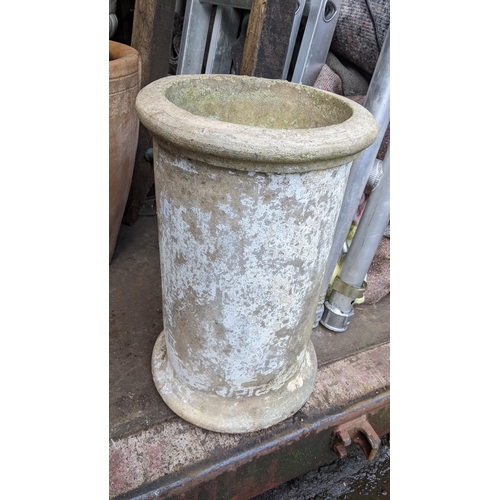 505 - A selection of garden planters to include a stoneware example of square form and cast with flower he... 