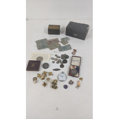 513 - A mixed lot to include silver British coinage and others together with German notes, cap badges and ... 