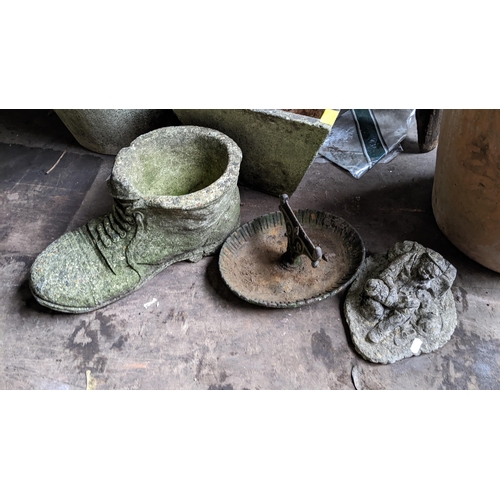 515 - A Victorian cast iron boot scraper together with two stoneware garden ornaments
Location: RCon 
If t... 