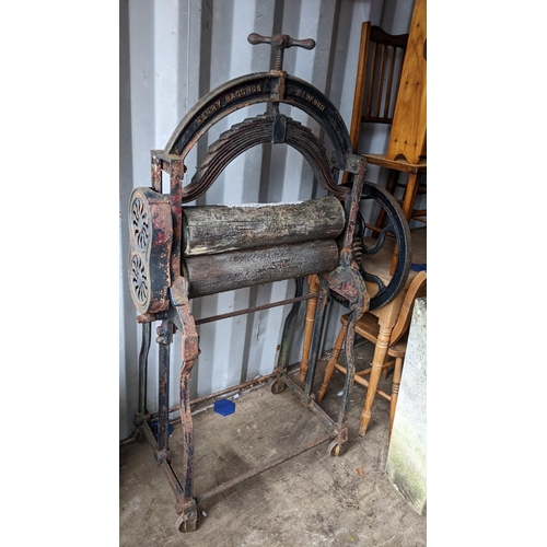 517 - A Victorian Henry Bacchus, Bedford cast iron and treen mangle 153cm h x 91cm w Location: R Con
If th... 