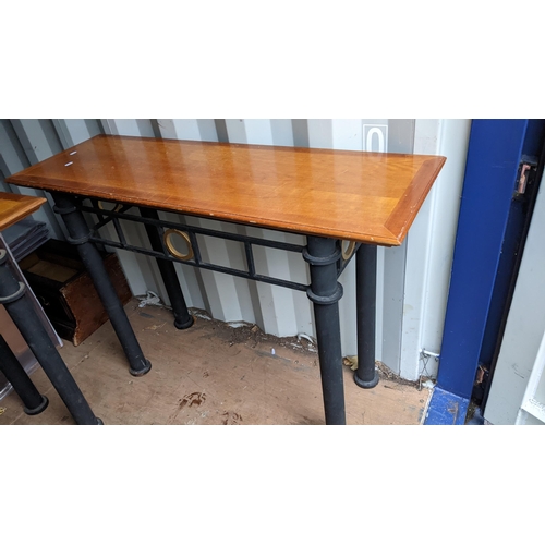 519 - A pair of vintage satinwood topped console tables having cast iron bases 85cm h x 122.5cm w Location... 