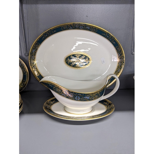 521 - A Royal Doulton Carlyle pattern dinner service to include six dinner plates, smaller plates, side pl... 