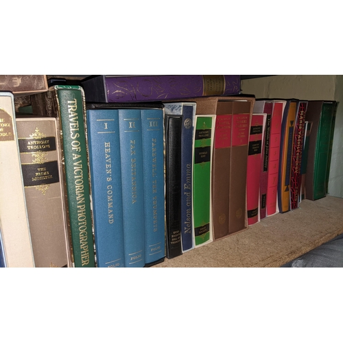 439 - A large collection of cased Folio Society books to include Columbus on Himself, Travels of a Victori... 