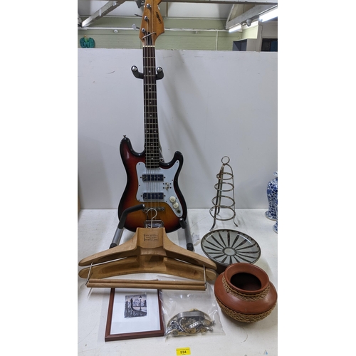 534 - A mixed lot to include a 'Satellite' bass guitar on a stand, two Portuguese wooden vintage coat hang... 