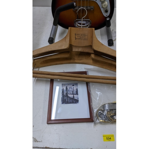 534 - A mixed lot to include a 'Satellite' bass guitar on a stand, two Portuguese wooden vintage coat hang... 