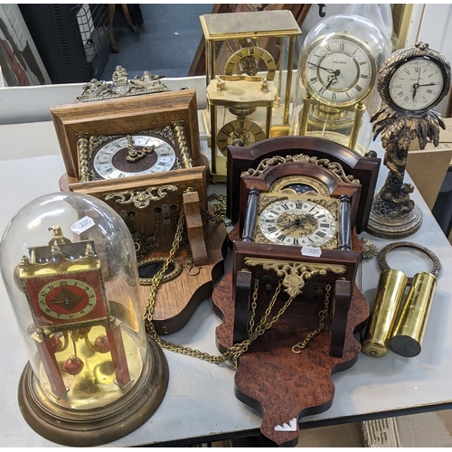 535 - A mixed lot of clocks to include two glass domed skeleton clocks, two cased wall clocks and others
L... 