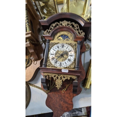 535 - A mixed lot of clocks to include two glass domed skeleton clocks, two cased wall clocks and others
L... 