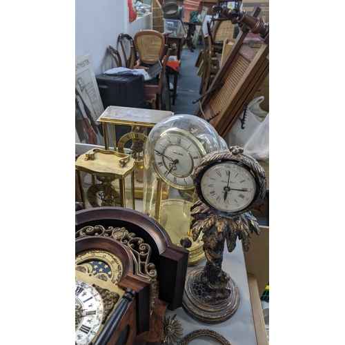 535 - A mixed lot of clocks to include two glass domed skeleton clocks, two cased wall clocks and others
L... 