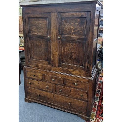 304 - A George II oak food cupboard having two cupboards above drawers, 184cm h x 130.5cm w
Location:A2B
I... 