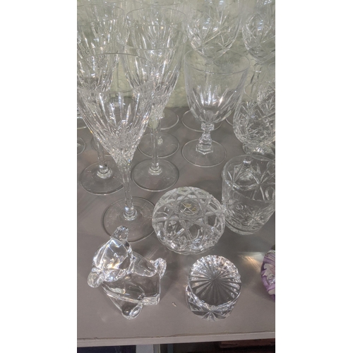 375 - A large lot of glassware to include Waterford Lismore red wine glass, Waterford teddy bear, a select... 