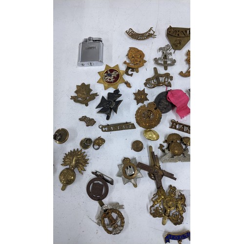 437 - A collection of military cap badges to include Royal Scots Guards, Australian Commonwealth Military ... 