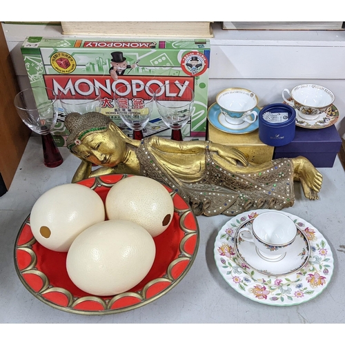 303 - A mixed lot to include ostrich eggs, gilt model of a Buddha boxed collectables including a Swarovski... 