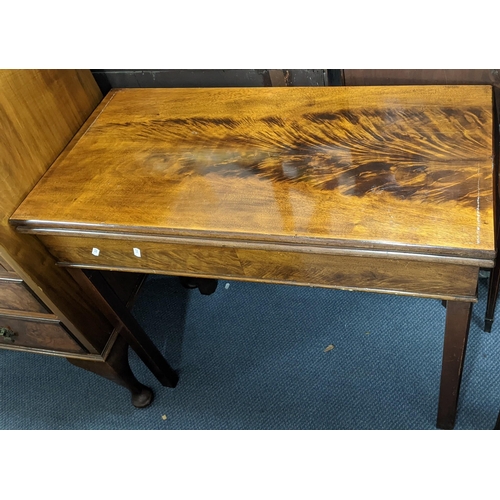 309 - A Georgian mahogany fold-over top tea table on square chamfered supports, 72cm h x 85.5cm w
Location... 