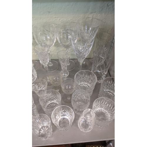 375 - A large lot of glassware to include Waterford Lismore red wine glass, Waterford teddy bear, a select... 