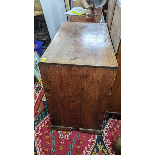 384 - An 18th century mahogany chest of drawers, provincially made with simulated pine sides and a caddy t... 