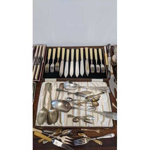 433 - A selection of silver plated cutlery, together with two boxed sets of silver handled knives, and thr... 