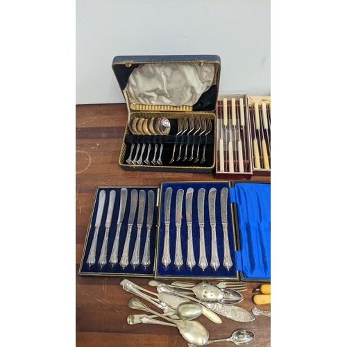 433 - A selection of silver plated cutlery, together with two boxed sets of silver handled knives, and thr... 