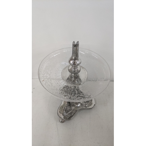 543 - A silver plated and glass pedestal dish having an etched glass bowl with a cast swan base on three b... 