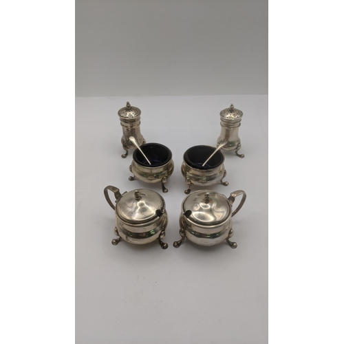 12 - Sterling silver condiment pots to include two mustard, two salts with glass liners and two pepper po... 