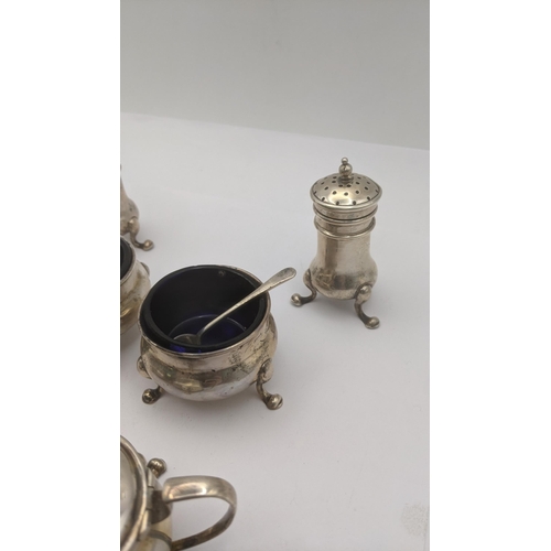 12 - Sterling silver condiment pots to include two mustard, two salts with glass liners and two pepper po... 