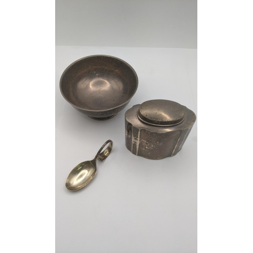 15 - Silver to include a tea caddy pot hallmarked Birmingham 1920, along with a sugar bowl and a tea cadd... 