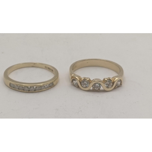 38 - Two 9ct yellow gold ladies rings to include a 9ct and diamond channel setting half eternity example ... 