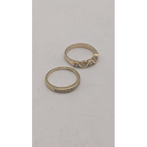 38 - Two 9ct yellow gold ladies rings to include a 9ct and diamond channel setting half eternity example ... 