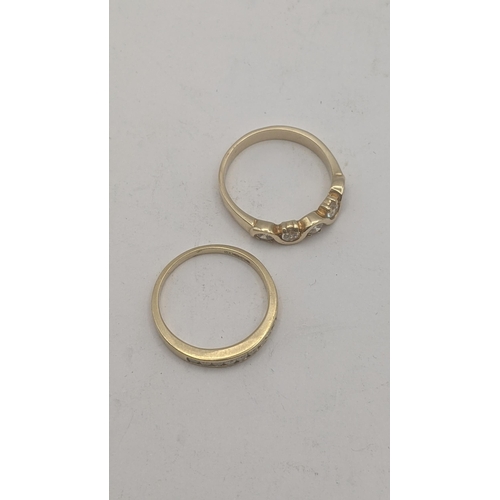 38 - Two 9ct yellow gold ladies rings to include a 9ct and diamond channel setting half eternity example ... 