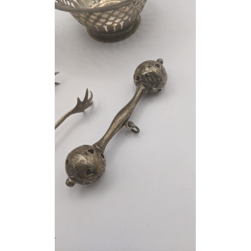 4 - Silver to include a Christening cup hallmarked Birmingham 1965, silver toy rattle, sugar tongs and a... 