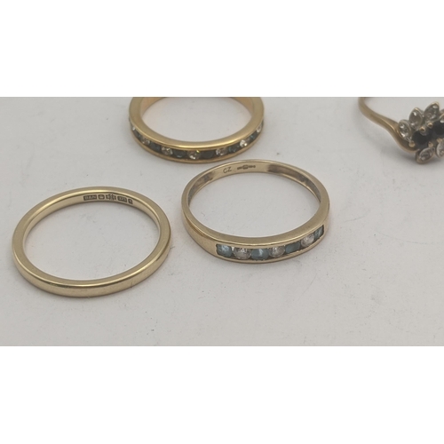 45 - Four ladies rings to include a 9ct yellow gold wedding band 1.8 g, 9ct yellow gold diamond and sapph... 