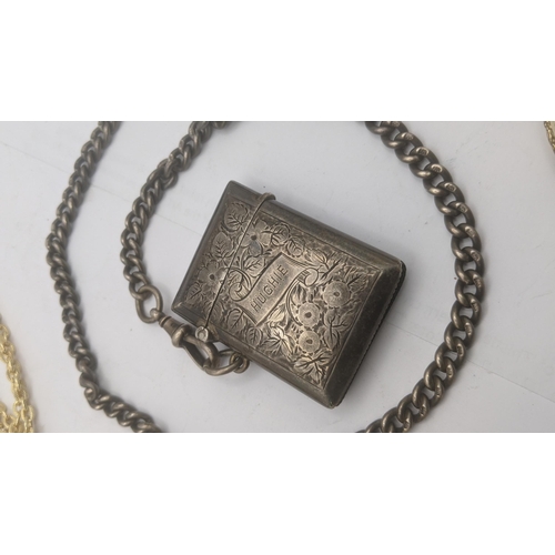 46 - A mixed lot to include a floral engraved vesta case on a silver chain with later dog clip clasp, 65.... 