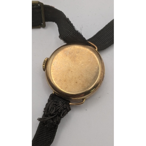 5 - A 9ct yellow gold cased ladies wrist watch on a fabric strap A/F 
Location:CAB2
If there is no condi... 