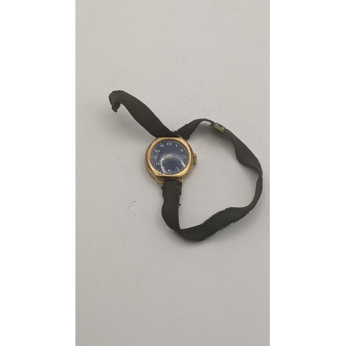 5 - A 9ct yellow gold cased ladies wrist watch on a fabric strap A/F 
Location:CAB2
If there is no condi... 