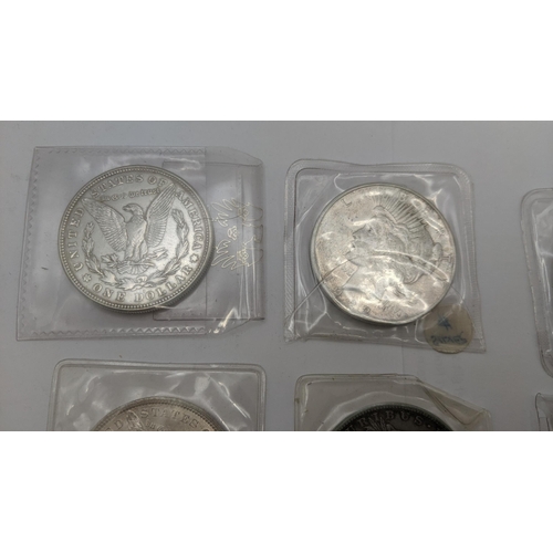 68 - A group of American silver coinage comprising 8 Morgan dollars, 1884, 1921, 1883 and others together... 