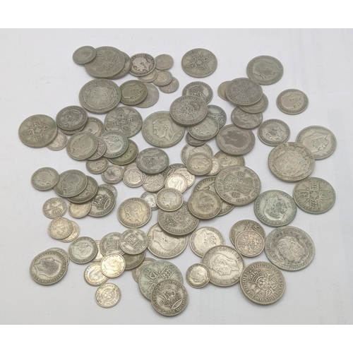 69 - A collection of pre 1946 silver British coinage to include three pence coins, florins and two shilli... 