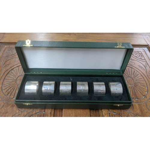 7 - United Cutlers set of six silver napkin rings hallmarked Sheffield 2000, in a fitted case, total wei... 