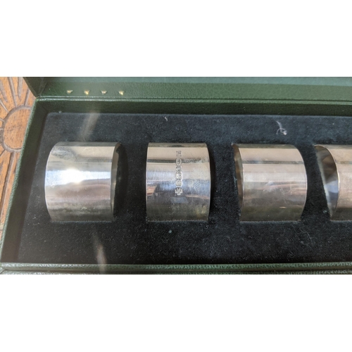 7 - United Cutlers set of six silver napkin rings hallmarked Sheffield 2000, in a fitted case, total wei... 