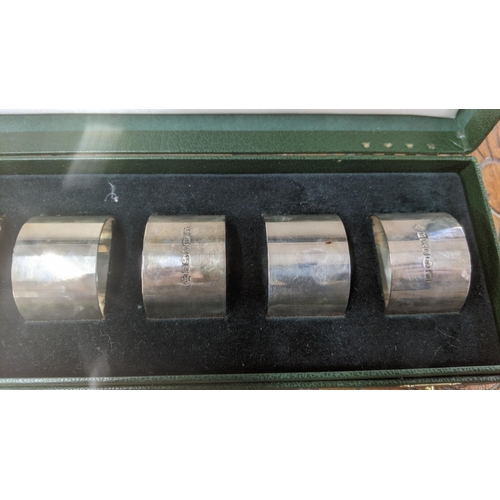 7 - United Cutlers set of six silver napkin rings hallmarked Sheffield 2000, in a fitted case, total wei... 