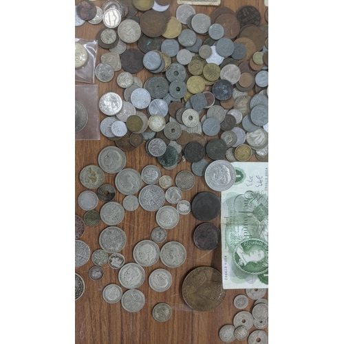 74 - A mixed lot of World coins and bank notes to include Victorian half crowns, Gothic florins and other... 