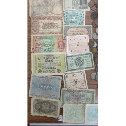 74 - A mixed lot of World coins and bank notes to include Victorian half crowns, Gothic florins and other... 